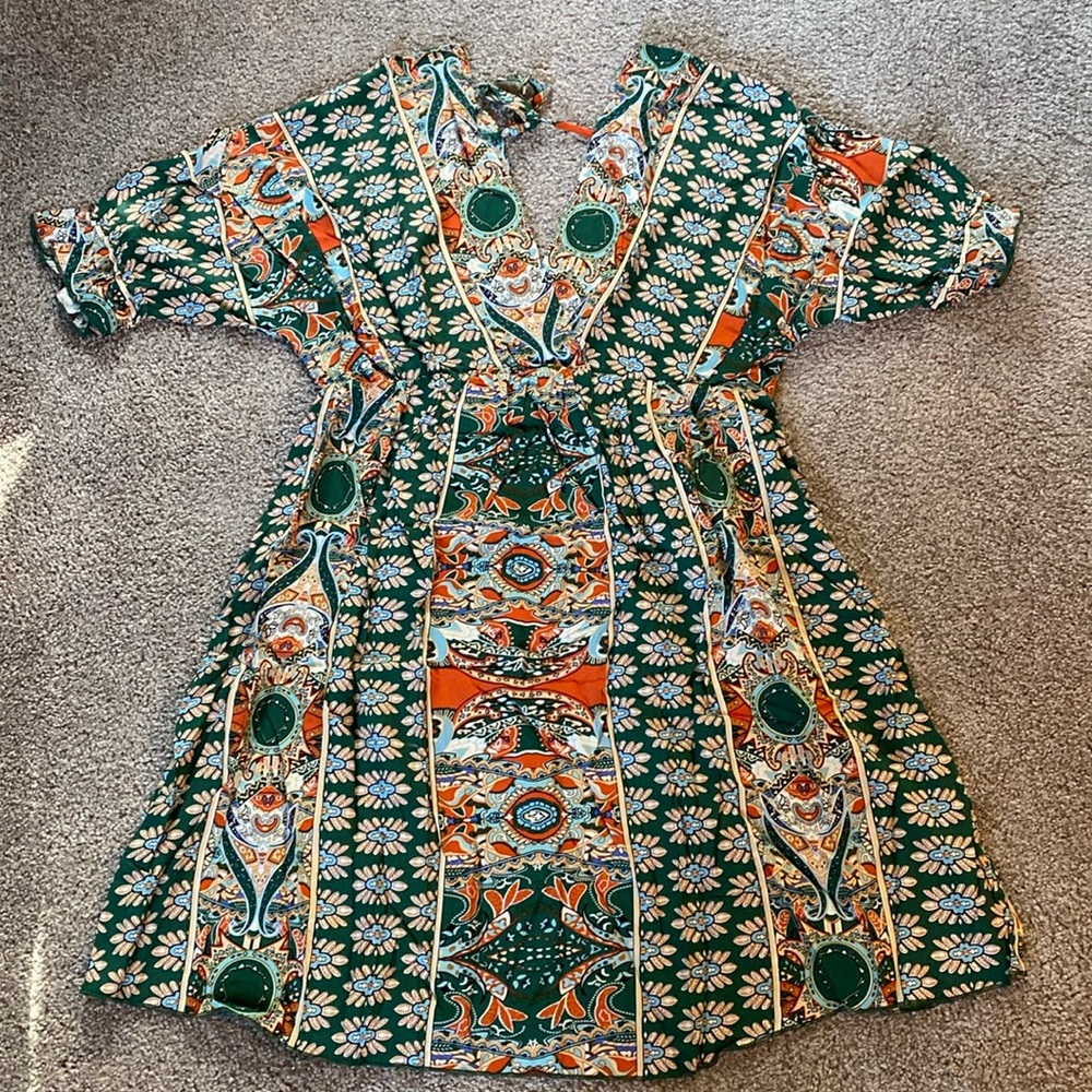 New, never worn.  Thin dress, that could double as a cover up.